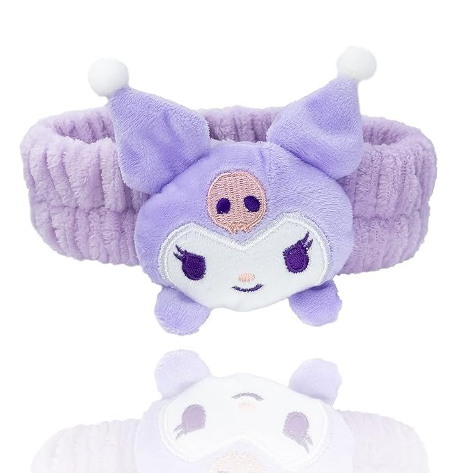 a purple headband with an animal face on it and a white ear muff