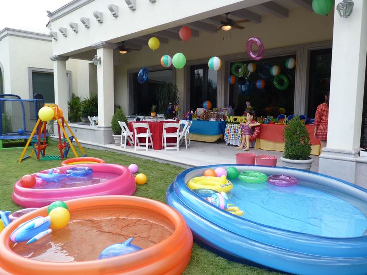 an inflatable pool is set up on the lawn for children to play with