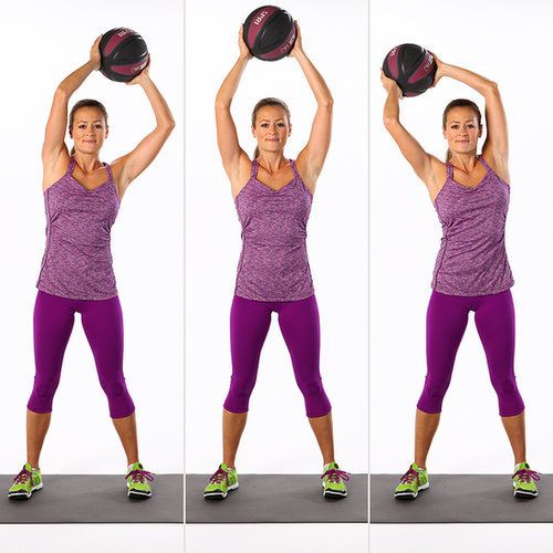 a woman holding a basketball while standing in front of her head and arms with both hands on the ball