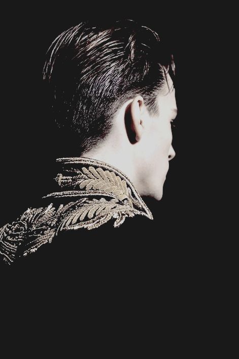 the back of a man's head with an elaborate collar