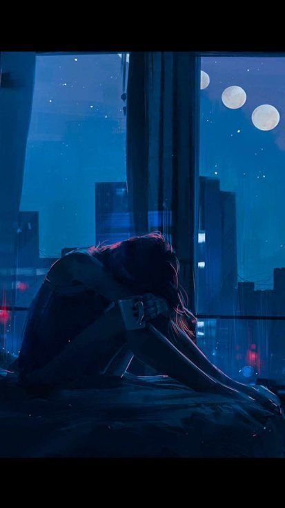 a woman sitting on the floor in front of a window with city lights behind her