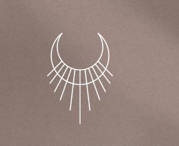 a drawing of a crescent with the sun in it's center on a gray background