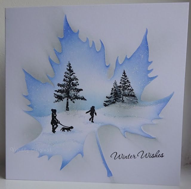 a handmade card with two children playing in the snow