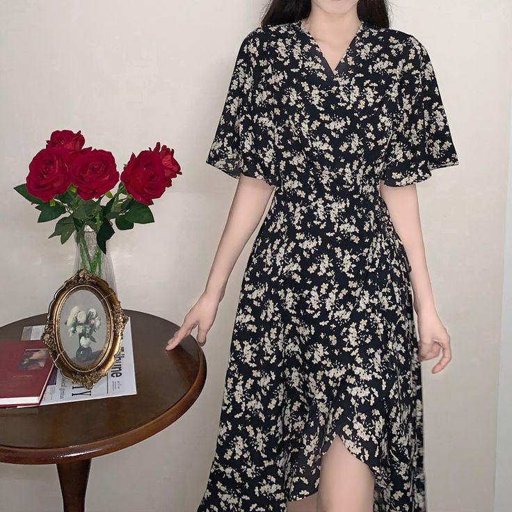 Floral irregular black dress Trendy Black V-neck Maxi Dress, Elegant Black Irregular Dress, Chic Black Asymmetrical Dress For Spring, Chic Black Asymmetrical V-neck Dress, Black Fitted Dress With Irregular Shape, Casual Irregular Maxi Dress For Spring, Black Fitted Asymmetrical Summer Dress, Black Fitted Asymmetrical Dress For Spring, Trendy Black Midi Dress With Short Sleeves