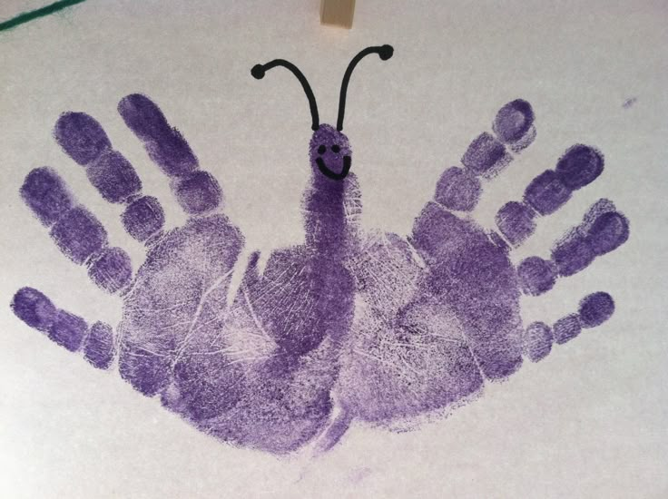 a child's handprint with a bug on it