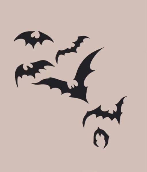 three bats are flying in the sky