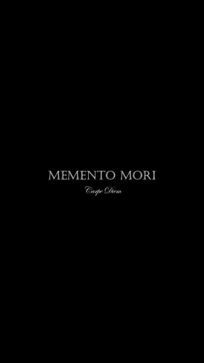 a black background with the words mementoo mori