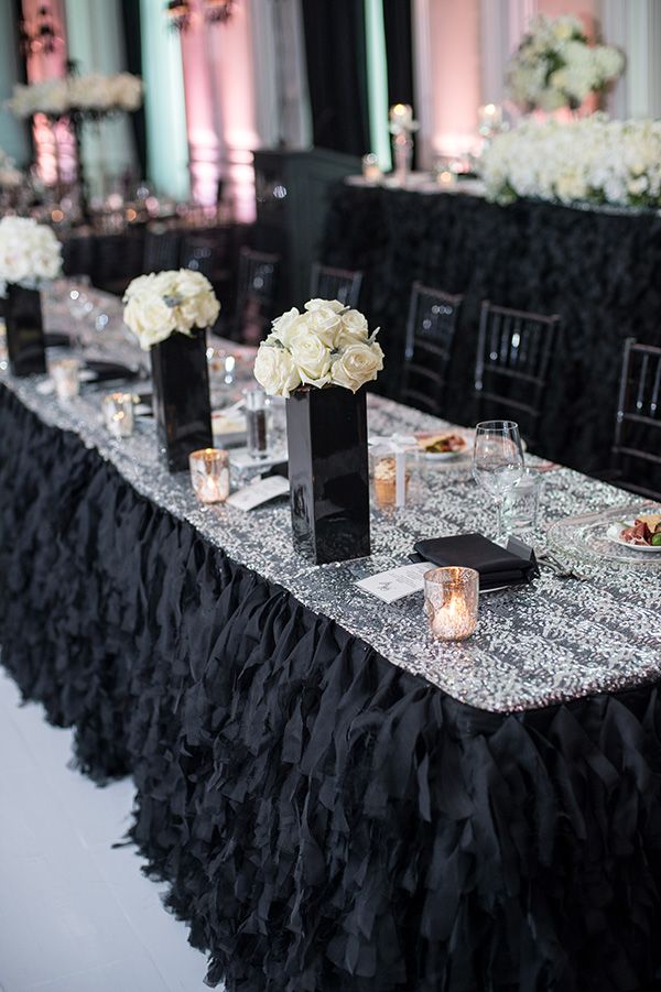 a long table with black and white decorations