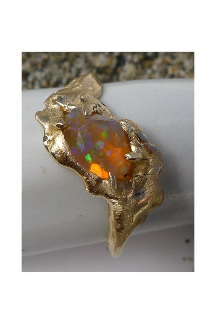 The Salt Marsh Shapeshifter Ring features an Ethiopian Opal, nestled a solid 14K gold band. Gold Opal Ring In 14k, Heirloom Gold Opal Ring With Polished Finish, Unique Gold Opal Promise Ring, Collectible Opal Ring In 14k Gold, Unique Gold Opal Ring In 14k, Unique Yellow Gold Opal Ring, Yellow Gold Opal Promise Ring With Polished Finish, Handmade 14k Gold Opal Wedding Ring, Unique 14k Gold Opal Ring