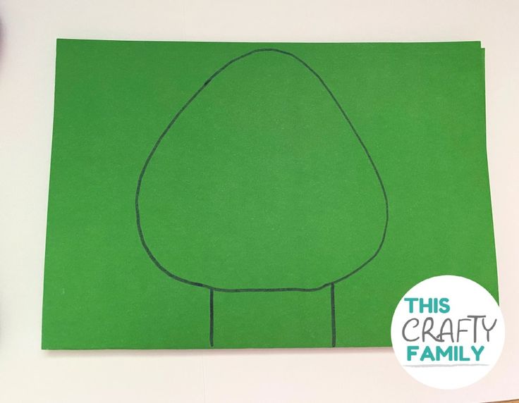 this is an image of a green paper cut out to look like a tree with the words, this crafty family on it