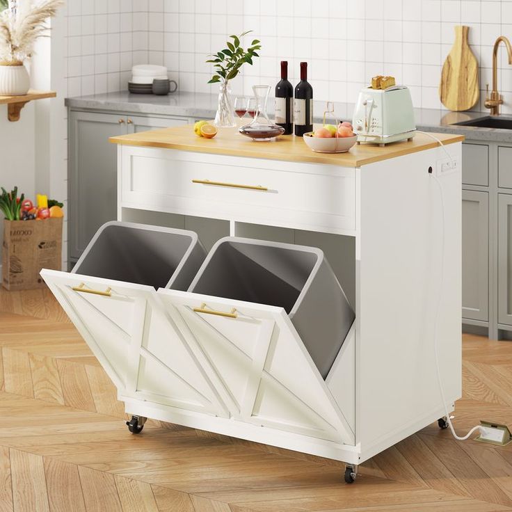 a kitchen island with two bins on it and some wine bottles in the back