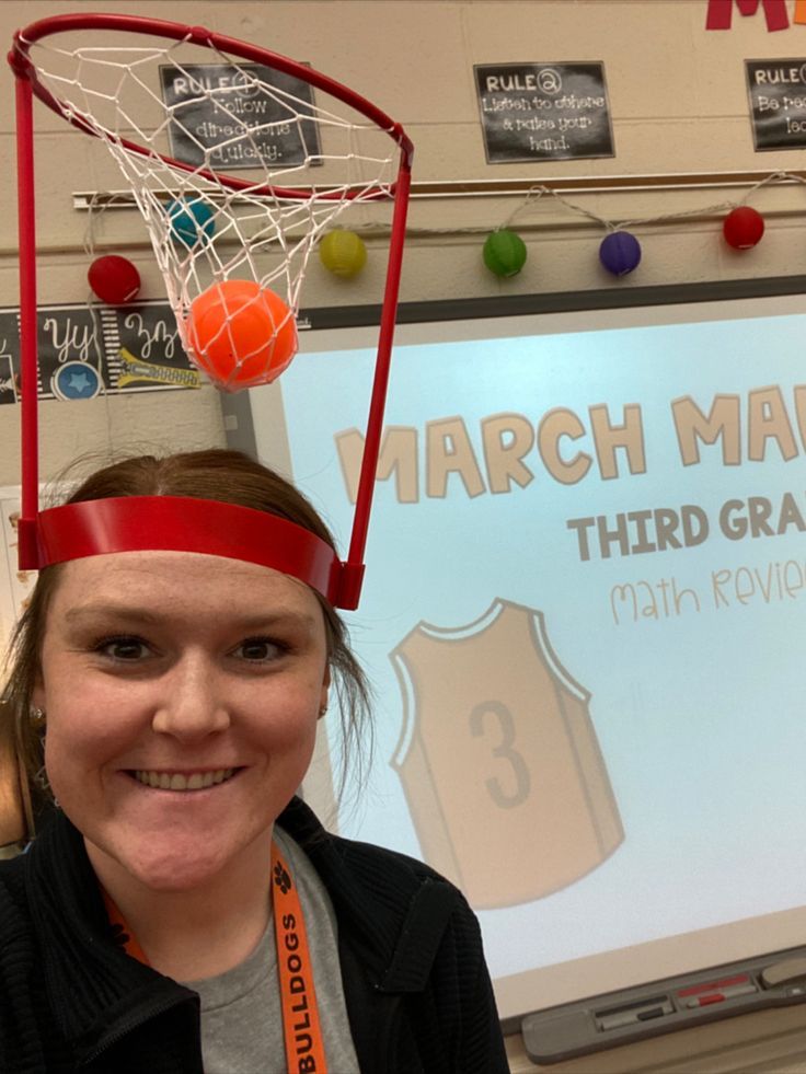 a woman wearing a headband with basketballs on it