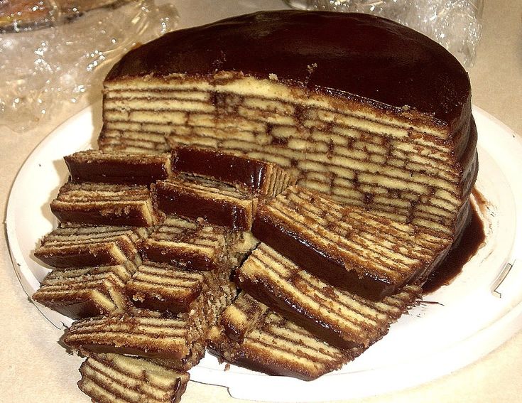 there is a chocolate cake on the plate with waffles cut in half to make it look like pancakes