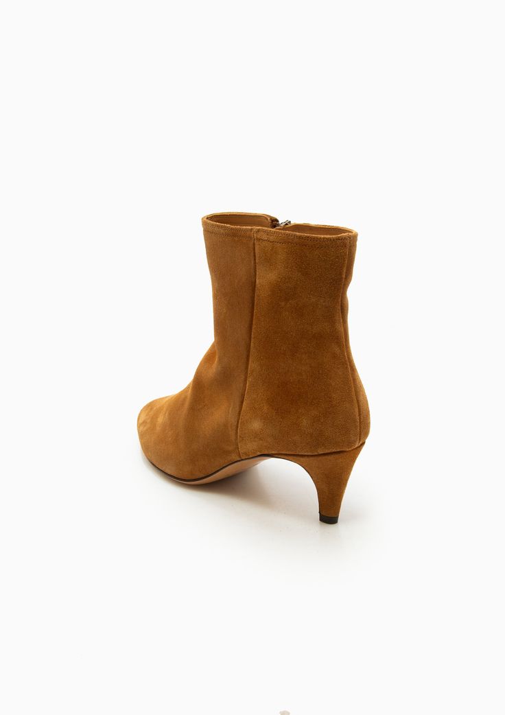 These rich suede ankle boots from Isabel Marant Étoile are set on a low covered heel, ensuring they will blend seamlessly into your everyday wardrobe. A concealed zipper at the side and almond toe completes the look. Calf Leather Upper Calf Leather Sole Heel height: 2" Made in Italy Fit runs small, we recommend going up a size if in between sizes. Isabel Marant Etoile, Suede Ankle Boots, Everyday Wardrobe, Isabel Marant, Cognac, Calf Leather, Heel Height, Leather Upper, Almond