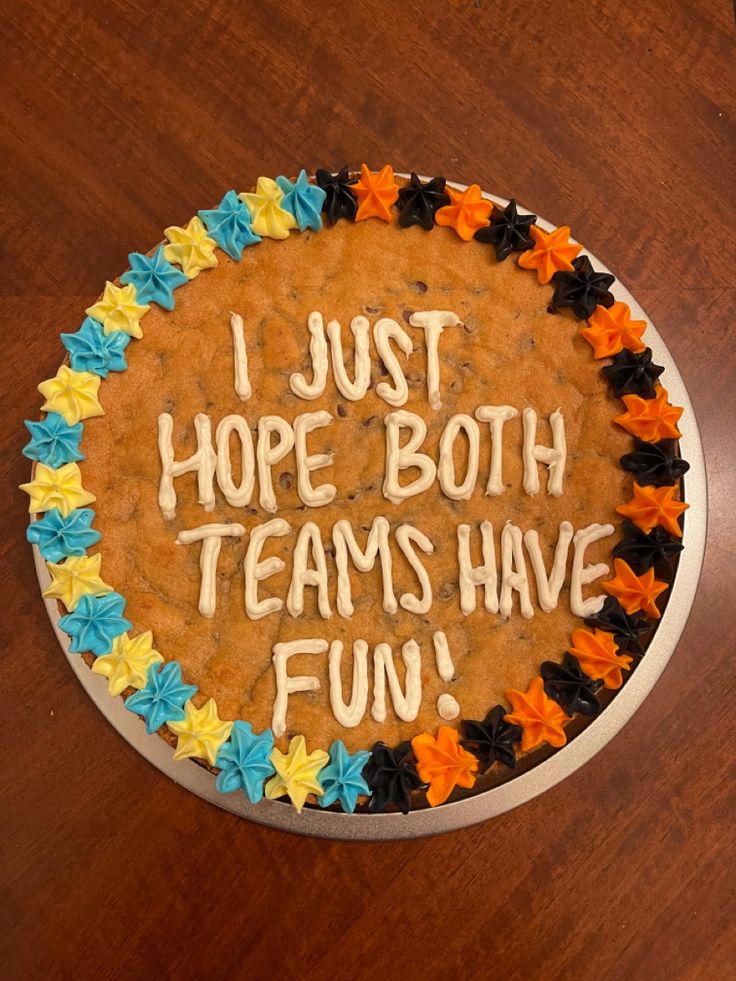 a birthday cake with the words i just hope both teams have fun written on it