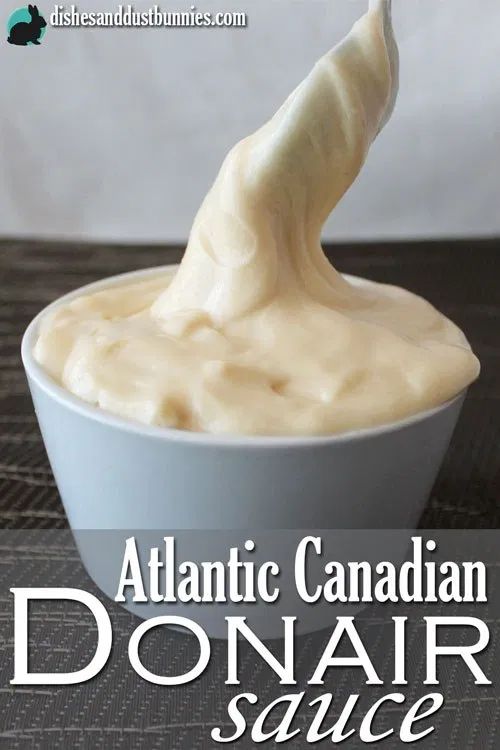 a bowl filled with cream sitting on top of a table