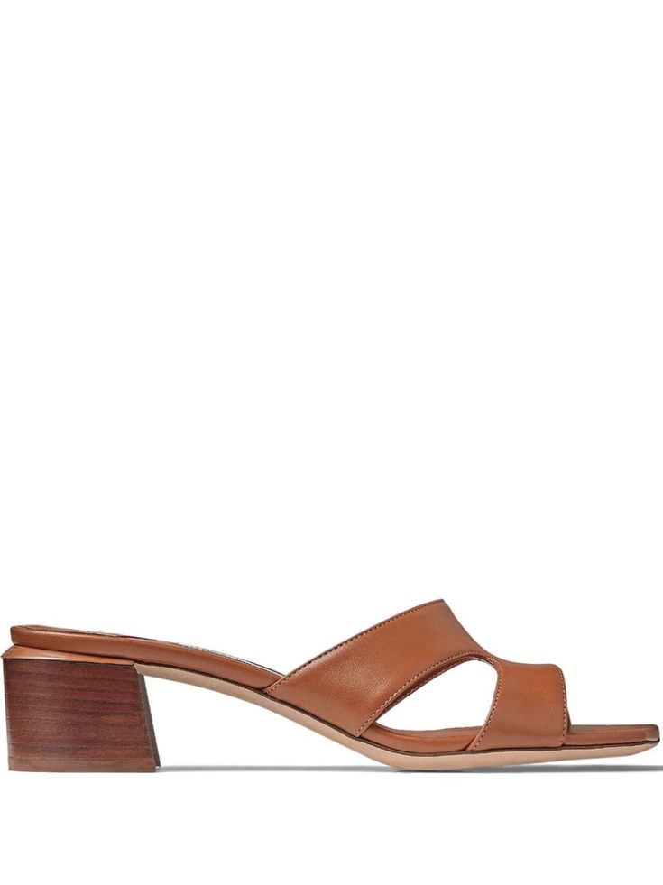 cognac brown lambskin cut-out detailing square open toe slip-on style branded leather insole low stacked heel leather outsole Brown Square Toe Mules For Formal Occasions, Brown Calf Leather Sandals With Sculpted Heel, Calf Leather Mules With Sculpted Low Heel, Classic Mules With Leather Lining, Classic Calf Leather Sandals With Block Heel, Brown Calf Leather Slides With Leather Lining, Classic Brown Slides For Spring, Brown Almond Toe Sandals With Deep Heel Cup, Classic Brown Sandals With Stacked Heel