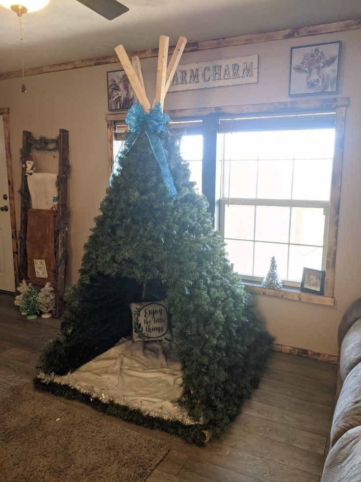 a christmas tree in the corner of a room