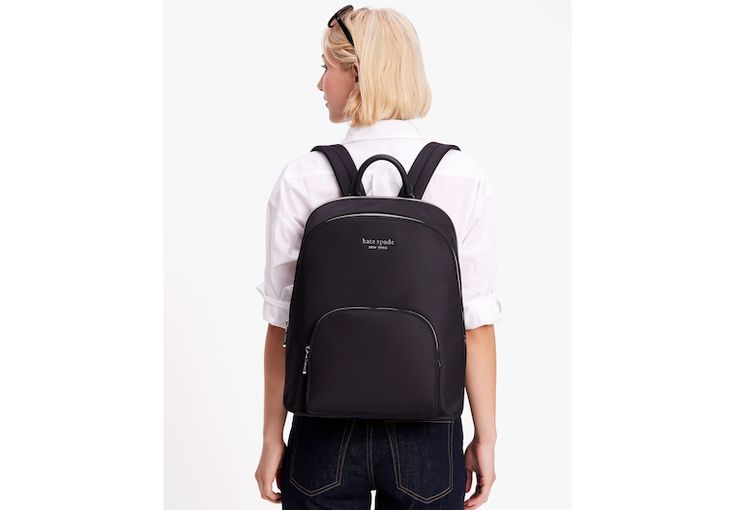 Made from our signature KSNYL nylon this backpack will keep your laptop safe and sound wherever you wander. This style has a 100% recycled nylon shell on the outside and 100% recycled polyester lining (and love) on the inside. | Kate Spade Sam Ksnyl Nylon Laptop Backpack, Black Trendy Nylon Backpack For Commuting, Kate Spade Nylon Backpack For Everyday Use, Kate Spade Nylon Backpack For Everyday, Kate Spade Everyday Nylon Backpack, Kate Spade Nylon Backpack For School, Kate Spade Nylon Standard Backpack, Kate Spade Nylon Backpack, Safe And Sound, Laptop Backpack