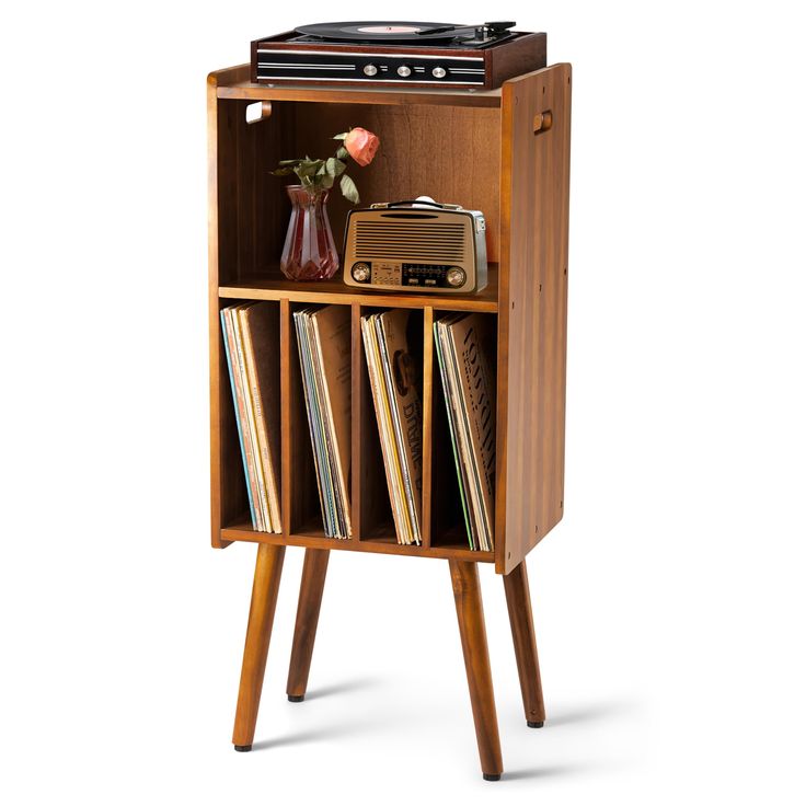 an old fashioned record player is in a wooden cabinet