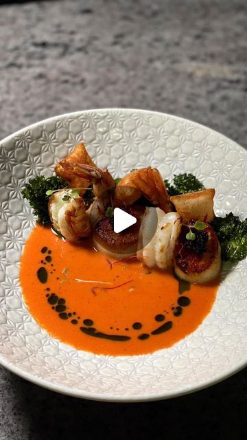 a white bowl filled with food on top of a table