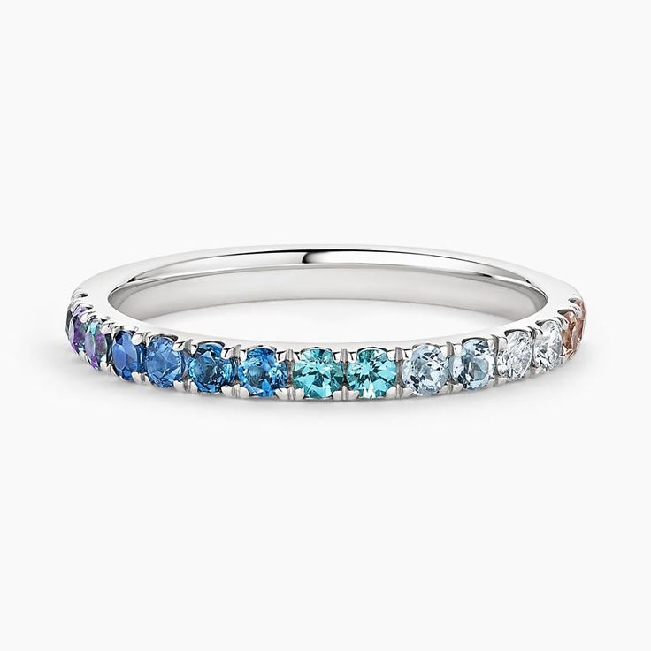 a white gold ring with blue and white diamonds