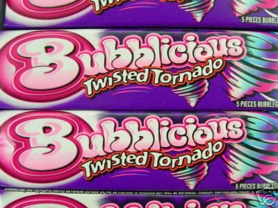 three bars of bubblegum twisted tornado are stacked on top of each other in front of the camera