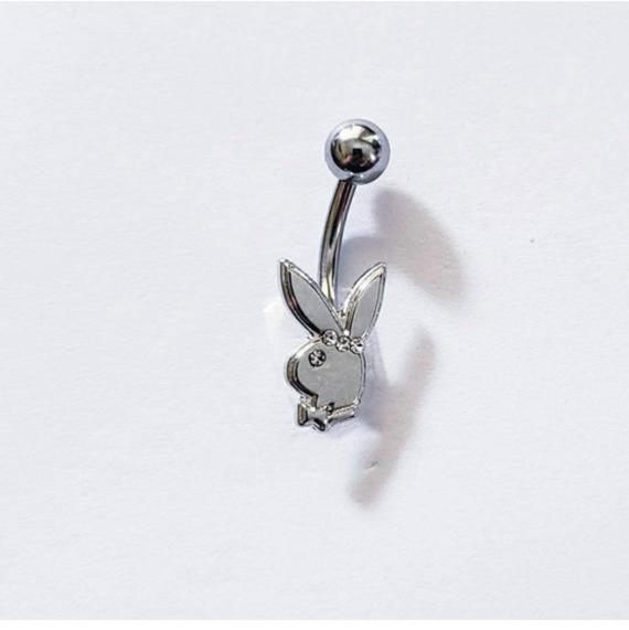 a silver nose ring with a rabbit on it