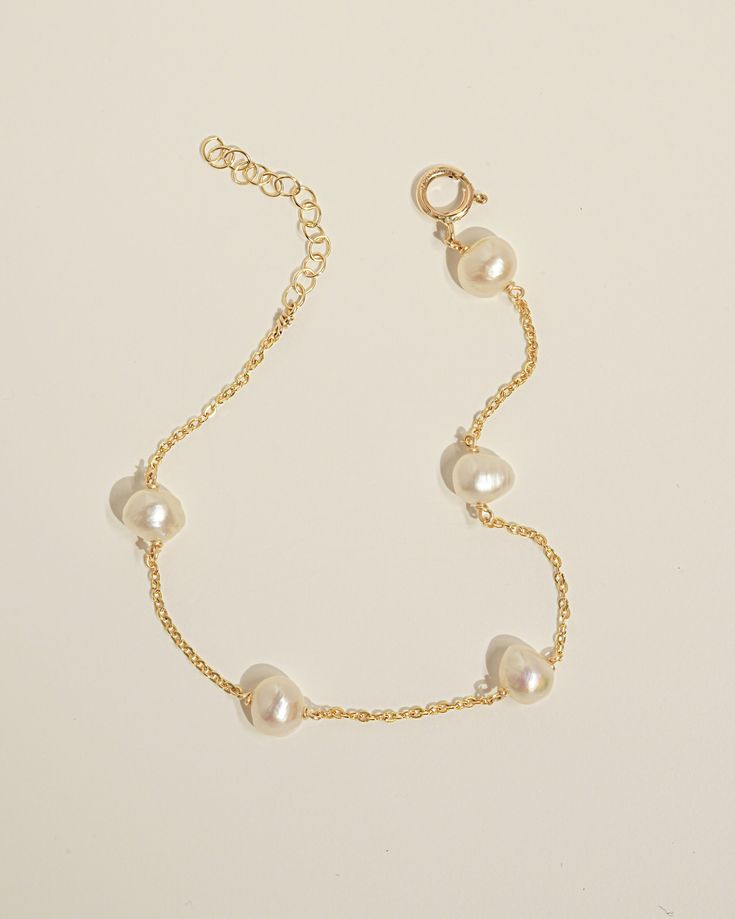 Product Details White irregular Pearl. Bracelet length is adjustable from 6 to 7 inches. Safe for sensitive skin. Available in 14k Gold Filled or Sterling Silver. Classic Pearl Bracelet With Extender, Classic Adjustable Hypoallergenic Pearl Bracelet, Adjustable Hypoallergenic Bracelets In 14k Gold, Adjustable Hypoallergenic Bracelet In 14k Gold, Hypoallergenic Adjustable Bracelets In 14k Gold, Adjustable Hypoallergenic 14k Gold Bracelet, Adjustable Delicate 14k Gold-filled Bracelets, Adjustable 14k Gold-filled Bracelet, Adjustable Classic 14k Gold-filled Bracelet