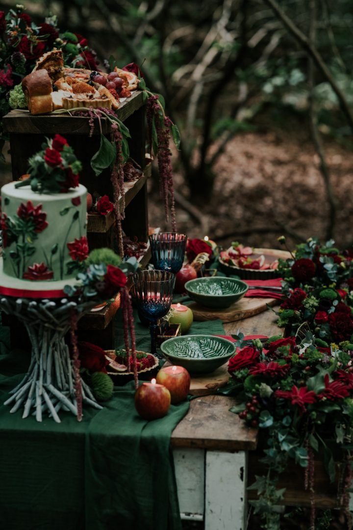 a table topped with lots of different types of cakes and desserts on top of it