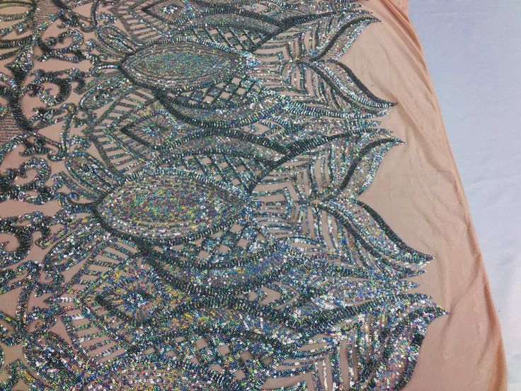 The sequins has especial and extraordinary design on the Mesh . It is super elegant and classy, The royalty design is embroidered with sequins on a mesh and can be used for dresses, tablecloths, backdrops, night gowns, skirts, prom dresses, wedding dresses, runners for tables, decorations and much more. Dear costumers: Please feel free to ask us, how much we have in stock on any item you want to purchase, do to the high volume of item in my store I don't put too much on my quantity box, but I do Royalty Design, Tables Decorations, Night Gowns, Fabric Roses, Gala Dresses, Sequin Fabric, 4 Way Stretch Fabric, Mesh Design, Silver Sequin