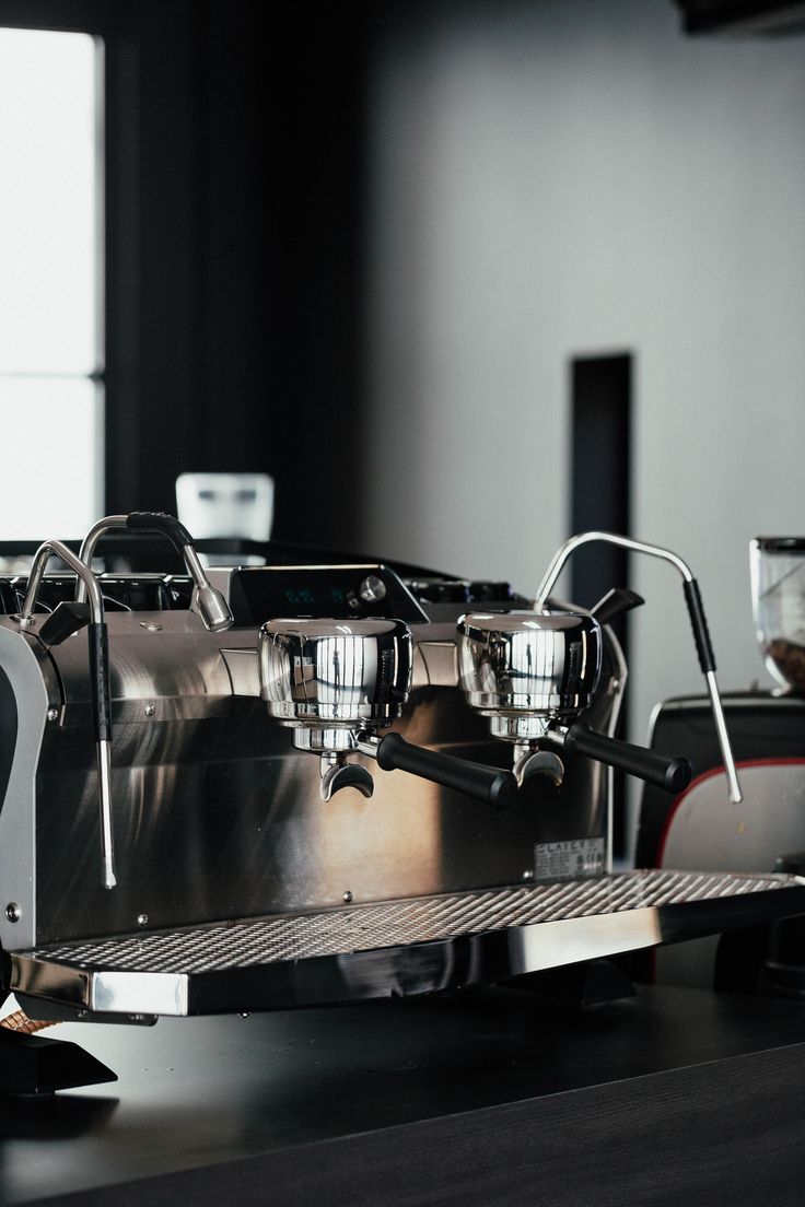 an espresso machine sitting on top of a counter