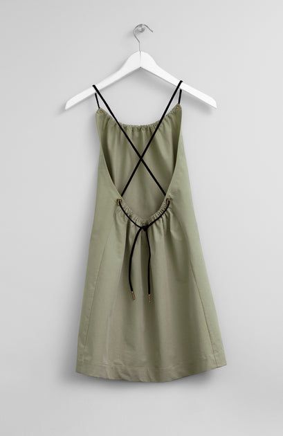 Chic Cross-back Mini Dress For Brunch, Chic Cross Back Mini Dress For Brunch, Summer Khaki Mini Dresses, Khaki Mini Summer Dresses, Khaki Mini Dress For Summer, Khaki Mini Length Summer Dress, Green Backless Sundress Mini Dress, Summer Brunch Mini Dress With Cross Back, Chic Mini Dress With Adjustable Cross Back Straps