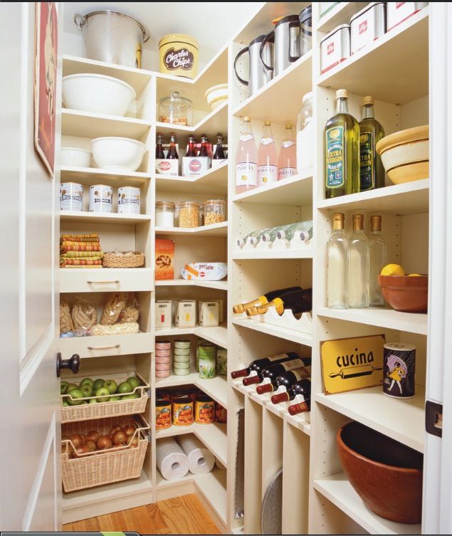 the pantry is stocked with many different types of food