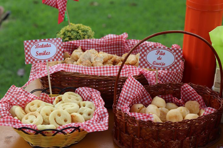 several baskets filled with food sitting on top of a table