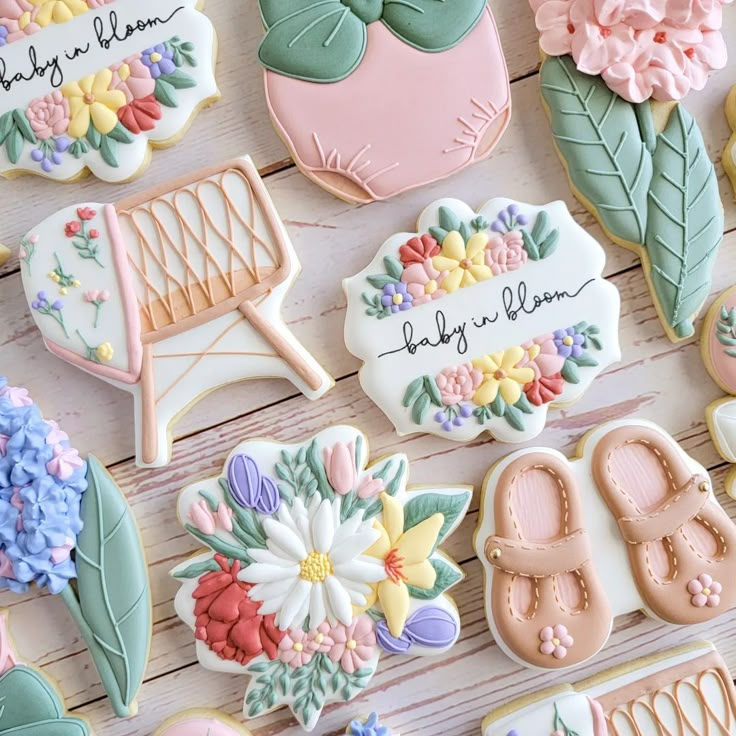 some decorated cookies are laying on a table