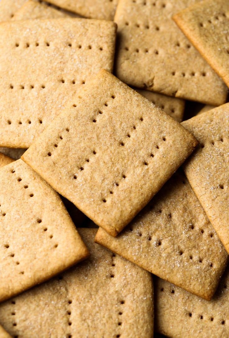 crackers are piled up on top of each other for a snack or appetizer