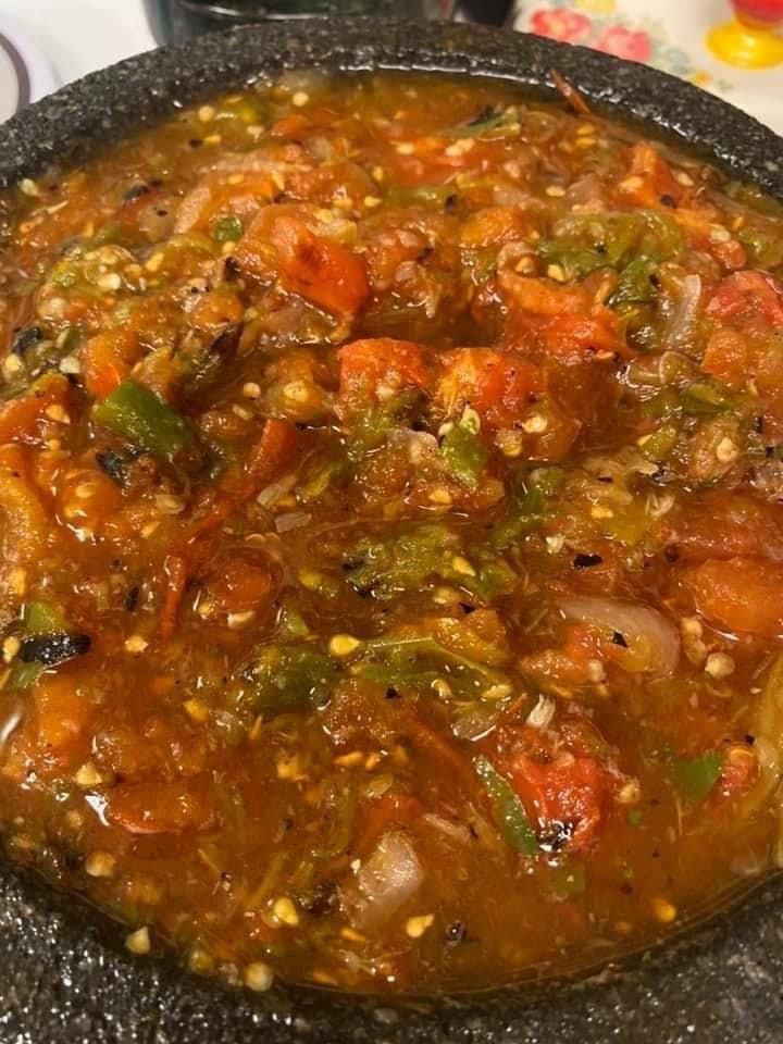 a bowl filled with soup sitting on top of a table