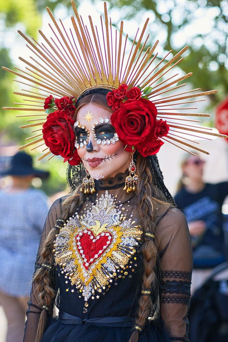 a woman with face paint and flowers on her head