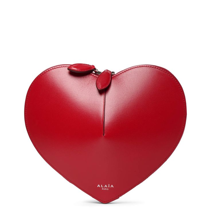 Red leather crossbody bag from Alaïa. The Le Coeur bag has the shape of a heart, features a zipped top and hangs from an adjustable shoulder strap.Measurements: L21 x H17 x W5 cmMade in Italy The Shape, A Heart, Leather Crossbody Bag, Leather Crossbody, Red Leather, Crossbody Bag, Shoulder Strap, In Italy, Italy