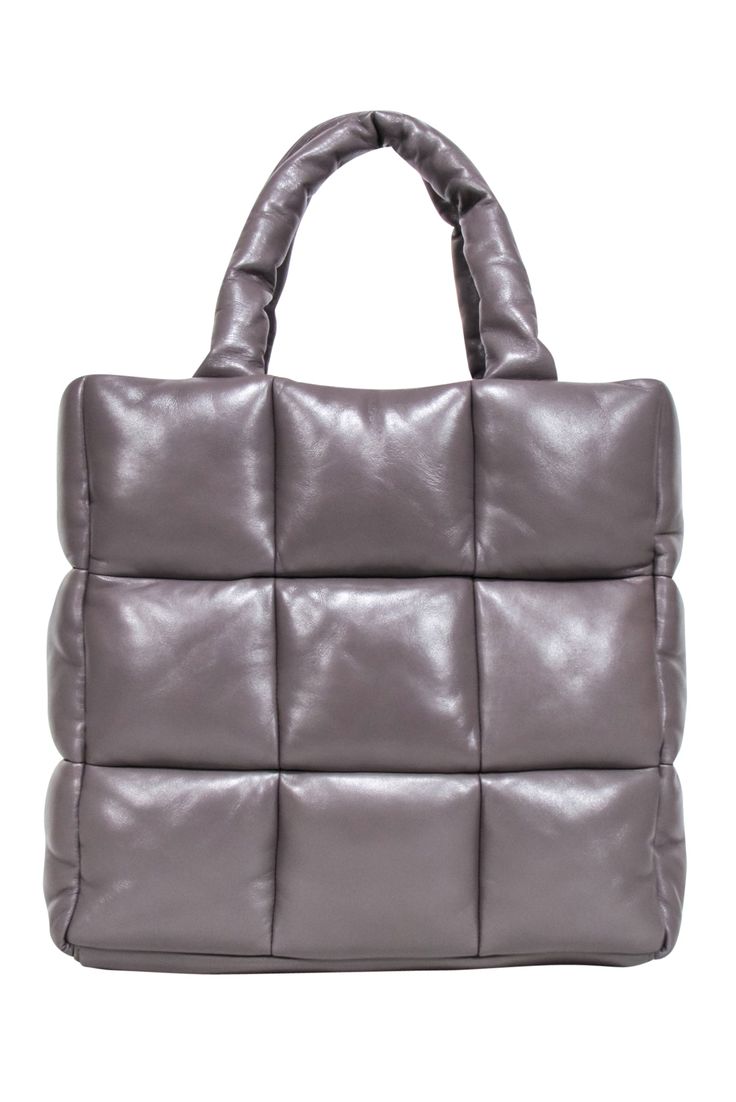 The "Assante" Puffy Tote from Stand Studio is the perfect way to add a touch of fun to your wardrobe. This trendy tote features gorgeous quilted leather in a subtle taupe hue, making it the perfect neutral to match any outfit. Show off your style with this must-have puffy bag! 100% Lamb Leather Lining 100% Polyester No top closure Dust bag included Double top handle Detachable crossbody strap Internal zipper pocket Width 15" Height 13" Depth 6" Strap drop 7" Quilted Leather Square Bag, Trendy Quilted Brown Bag, Quilted Square Leather Bag, Square Quilted Leather Bag, Trendy Quilted Leather Bag, Trendy Quilted Bags For Fall, Puffy Bag, Stand Studio, Bag Stand