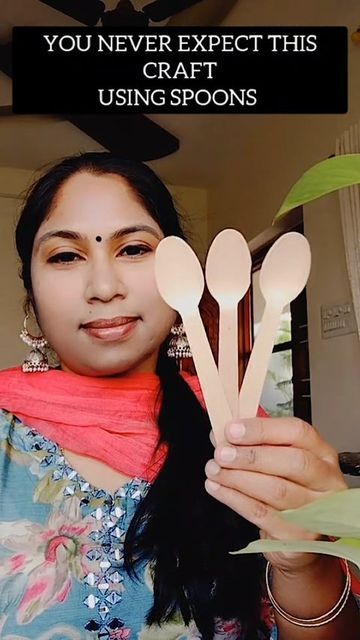 a woman holding three wooden spoons in front of her face with the caption you never expect this craft using spoons