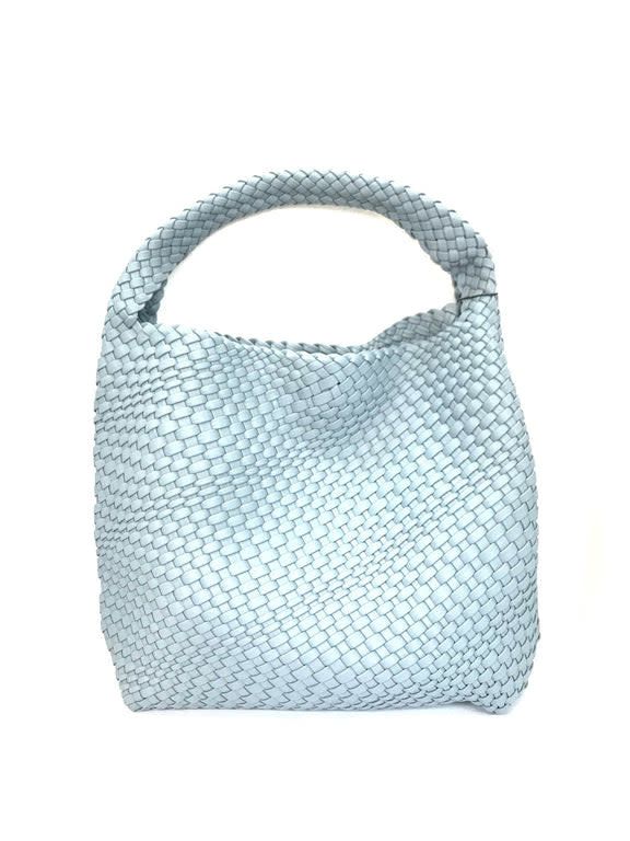 Tote-style woven bag with one top strap. A perfect touch to any outfit, on the go or out on the town. Woven Double Handle Bags For On-the-go, Woven Leather Crossbody Bucket Bag For On-the-go, Chic Bucket Bag With Braided Handles As Shoulder Bag, Chic Shoulder Bucket Bag With Braided Handles, Chic Straw Bag With Detachable Strap For Everyday Use, Woven Leather Satchel For On-the-go, Chic Bags With Braided Top Handles, Chic Bags With Braided Handles And Top Handle, Chic Top Handle Bag With Braided Handles