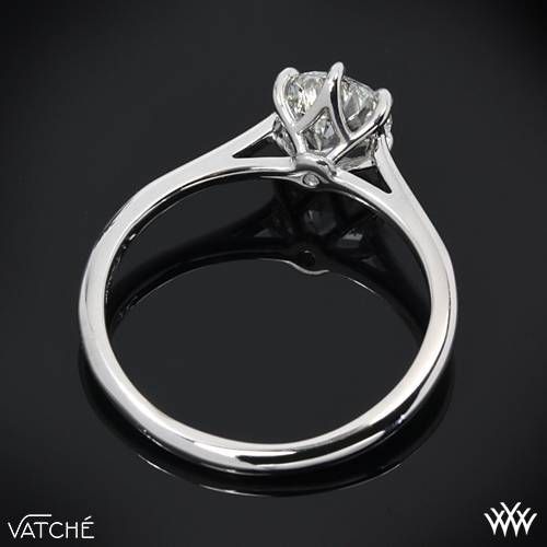 a white gold ring with two diamonds on it