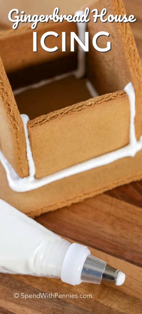 gingerbread house icing in a cardboard box with an empty bottle next to it