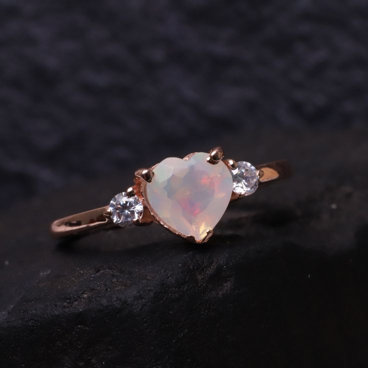 Opal Engagement Diamond Ring Heart Shape Opal Wedding Ring 14k Rose Gold Unique Ring Bridal Anniversary Gift October Birthstone Gift For Her Brand - LATELIERDBIJOUX Type Of Stone - Opal Stones Color - Fire opal Cut of Stones - Heart Birthstone - October Second Stone - CZ Diamond Second Stone Shape - Round Second Stone color - Colorless Check out my other items! PAYMENTS We accept PayPal, If we do not receive payments immediately we will hold the item only for one working day for your payments an Rose Gold Birthstone Ring For Valentine's Day Gift, White Heart Cut Jewelry For Proposal, Rose Gold Heart Cut Jewelry For Proposal, Heart Cut White Jewelry For Proposal, White Jewelry For Valentine's Day Proposal, Dainty Rose Gold Heart Ring For Proposal, Rose Gold 14k Gold Heart Ring For Weddings, Rose Gold Heart Cut Ring For Wedding Gift, Rose Gold Heart-shaped Promise Ring