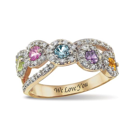 Express your affection for Mom with this elegant Personalized ring by ArtCarved®. This curvy split shank style features a graceful crossover row adorned with the three to five 3.0mm birthstones you select - one for each of her loving children - encompassed in a frame of dazzling cubic zirconia or diamond accents. A slender ribbon glides beneath the center row, lined with additional sparkling accents, and into the ring’s shank. Inside, the special sentiment you create - up to 15 characters in len Moonstone Engagement Ring Set, Birthstone Ring Mothers, Mothers Ring, Crossover Ring, Moonstone Engagement, Mother Rings, Moonstone Engagement Ring, Cubic Zirconia Jewelry, Personalized Rings