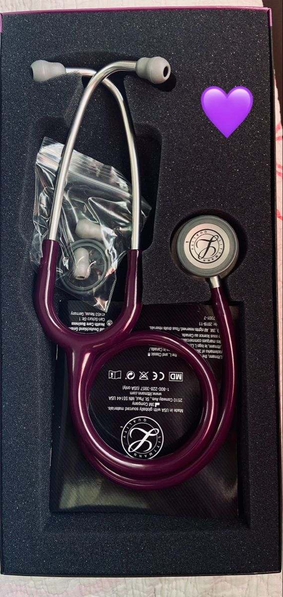 a purple stethoscope in a black box