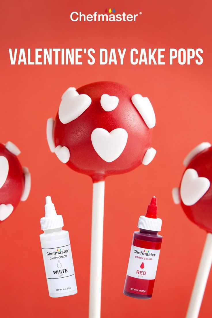 valentine's day cake pops with white hearts on them and red liquid in the middle