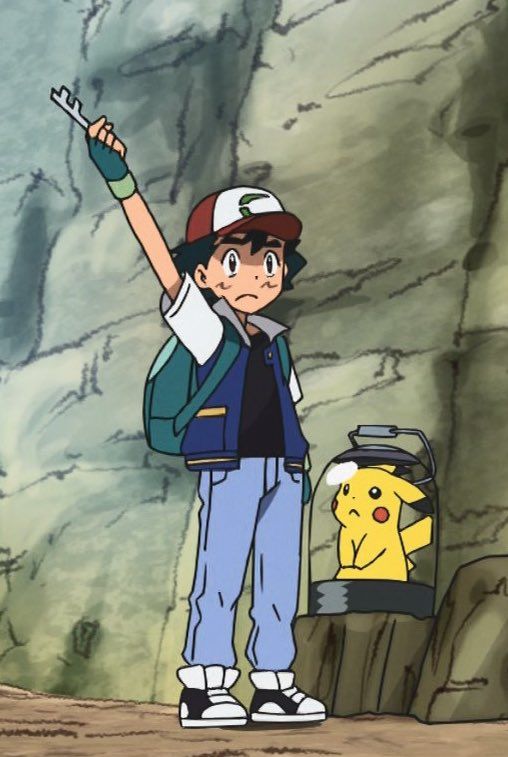 a person standing in front of a rock with a pokemon pikachu on it